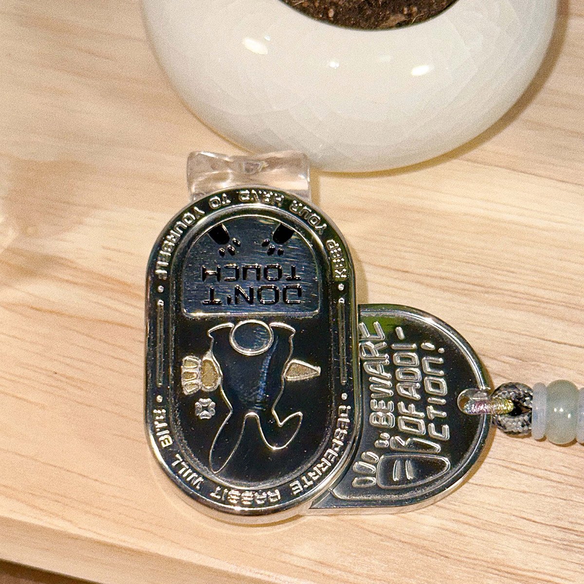 The "Irritable Bunny Ding-Ding Push Card Stress Relief Toy" made of stainless steel, a trendy plaything.