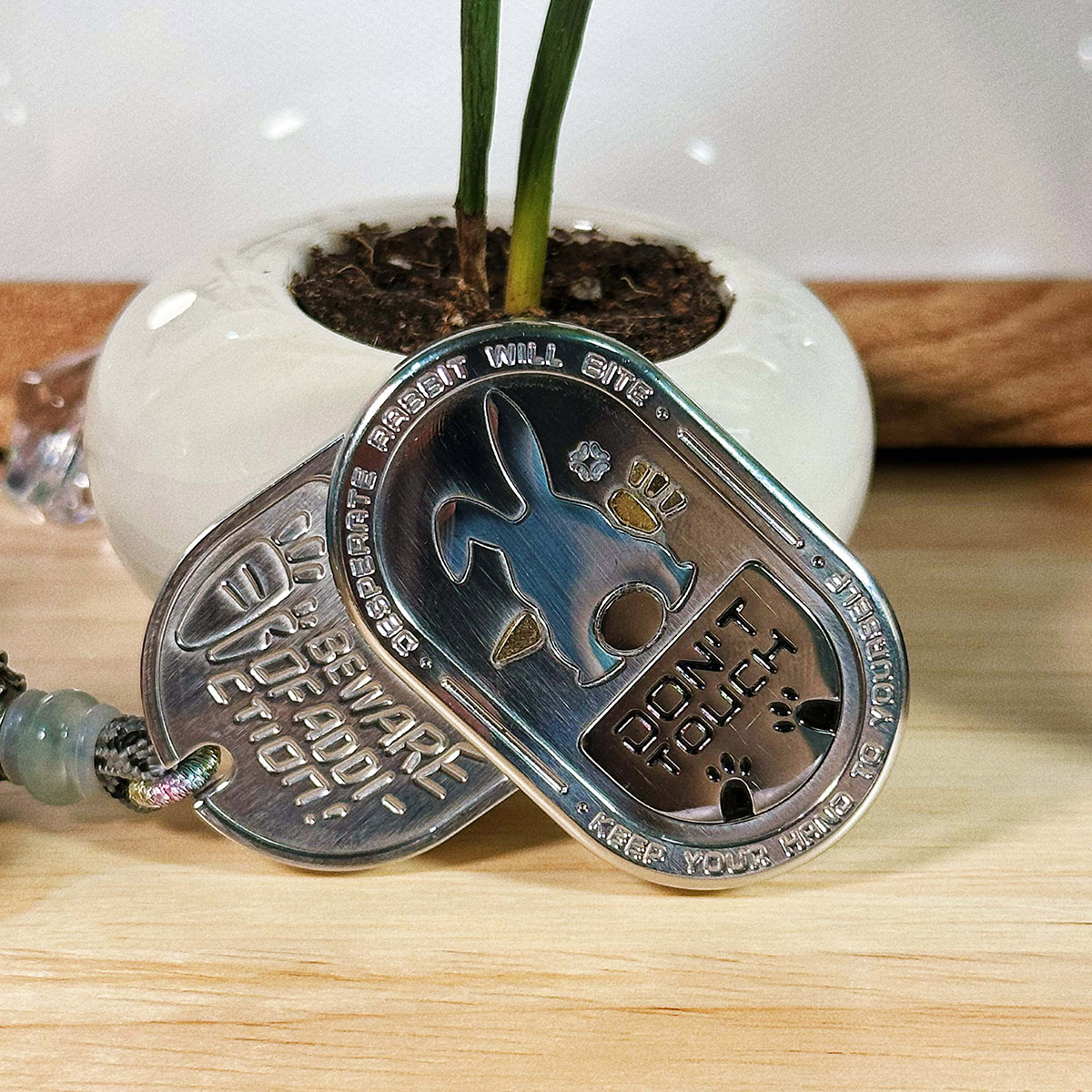 The "Irritable Bunny Ding-Ding Push Card Stress Relief Toy" made of stainless steel, a trendy plaything.